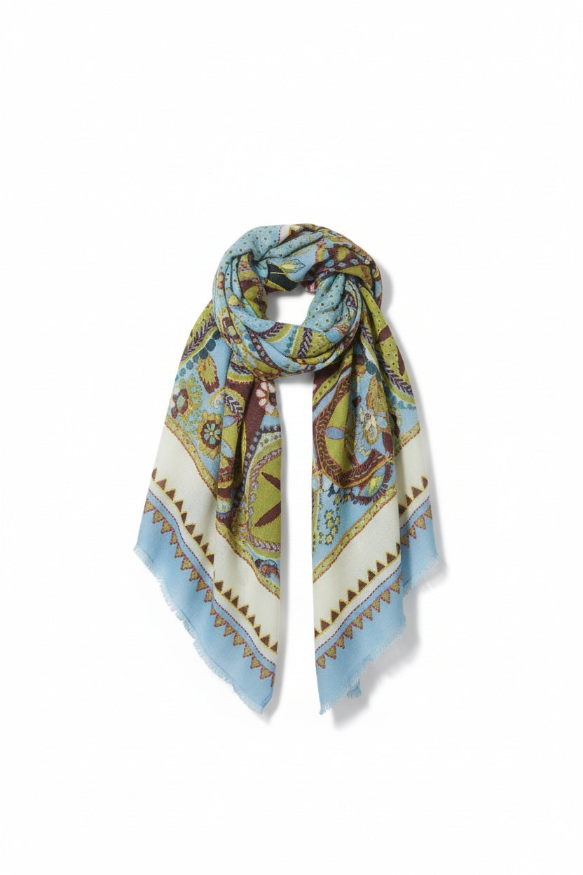 The STORIATIPIC ATHENA Wool Scarf with Embroidery in Ciel showcases blue, green, and beige tones with floral and geometric patterns, presented against a plain white background.