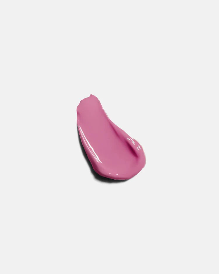 A pink tube of U BEAUTY - THE PLASMA LIP COMPOUND IN ORCHID stands upright on a light gray background, displaying the brand logo and product details in white text.
