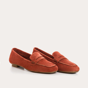 Top view of the REQINS - HEMA Suede Loafer in Briques, featuring a penny strap and visible stitching, highlighting the refined design of women’s loafers by REQINS against a plain white background.