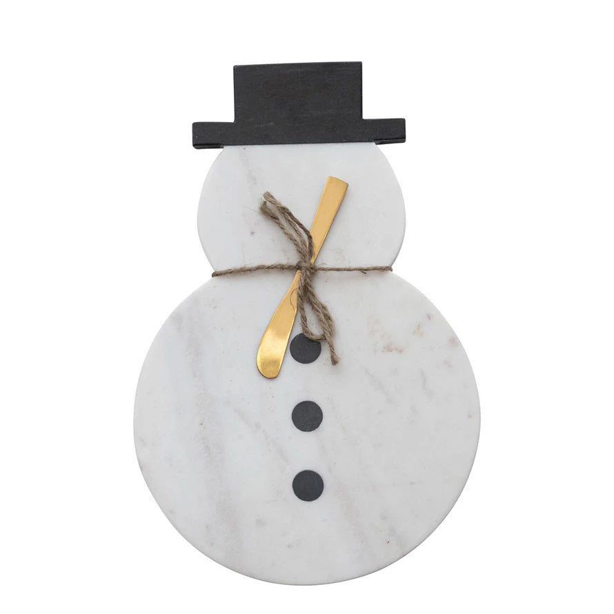 The CREATIVE COOP MARBLE SNOWMAN CUTTING BOARD WITH CANAPE KNIFE features a black hat, three black buttons, and a gold knife tied with twine—an adorable way to serve your favorite treats.