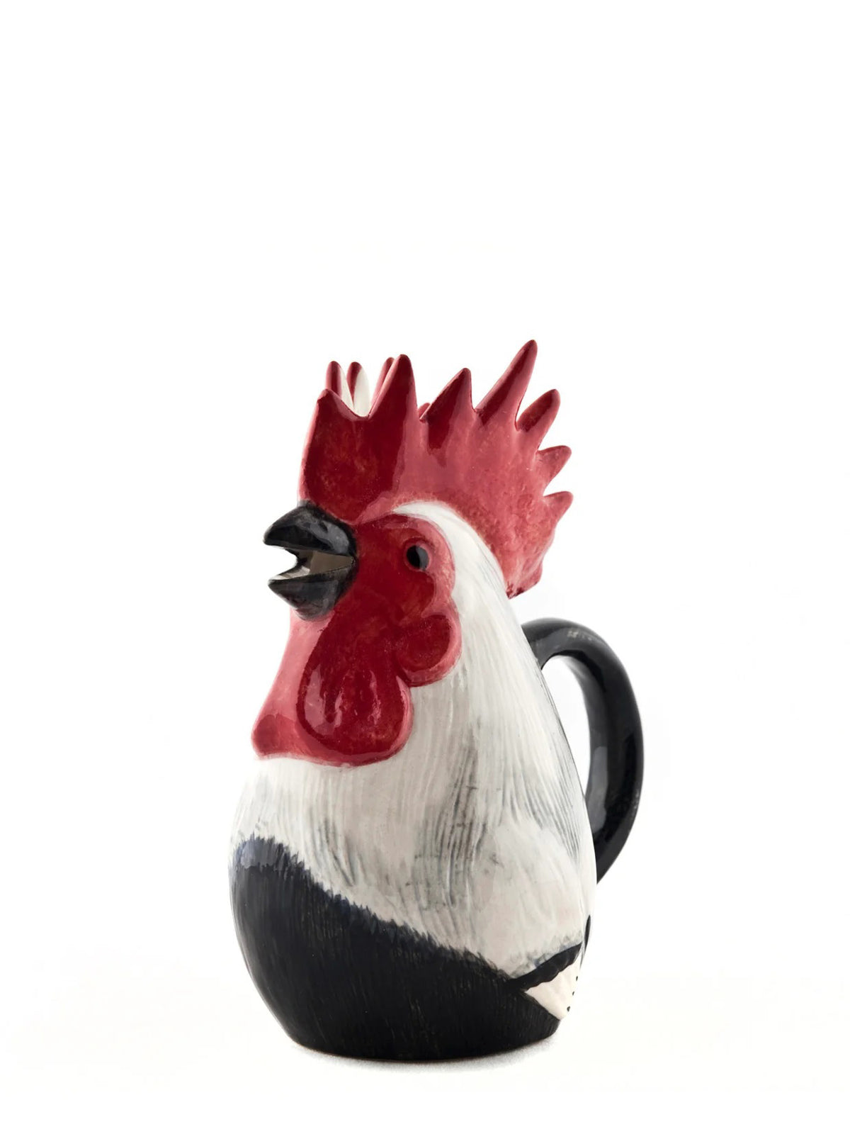 The QUAIL CERAMIC - DORKING ROOSTER JUG by QUAIL DESIGNS is a glazed ceramic mug shaped like a rooster, with a red comb, black beak, and white and black feathers reminiscent of a classic ceramic cockerel jug, displayed against a plain white background.