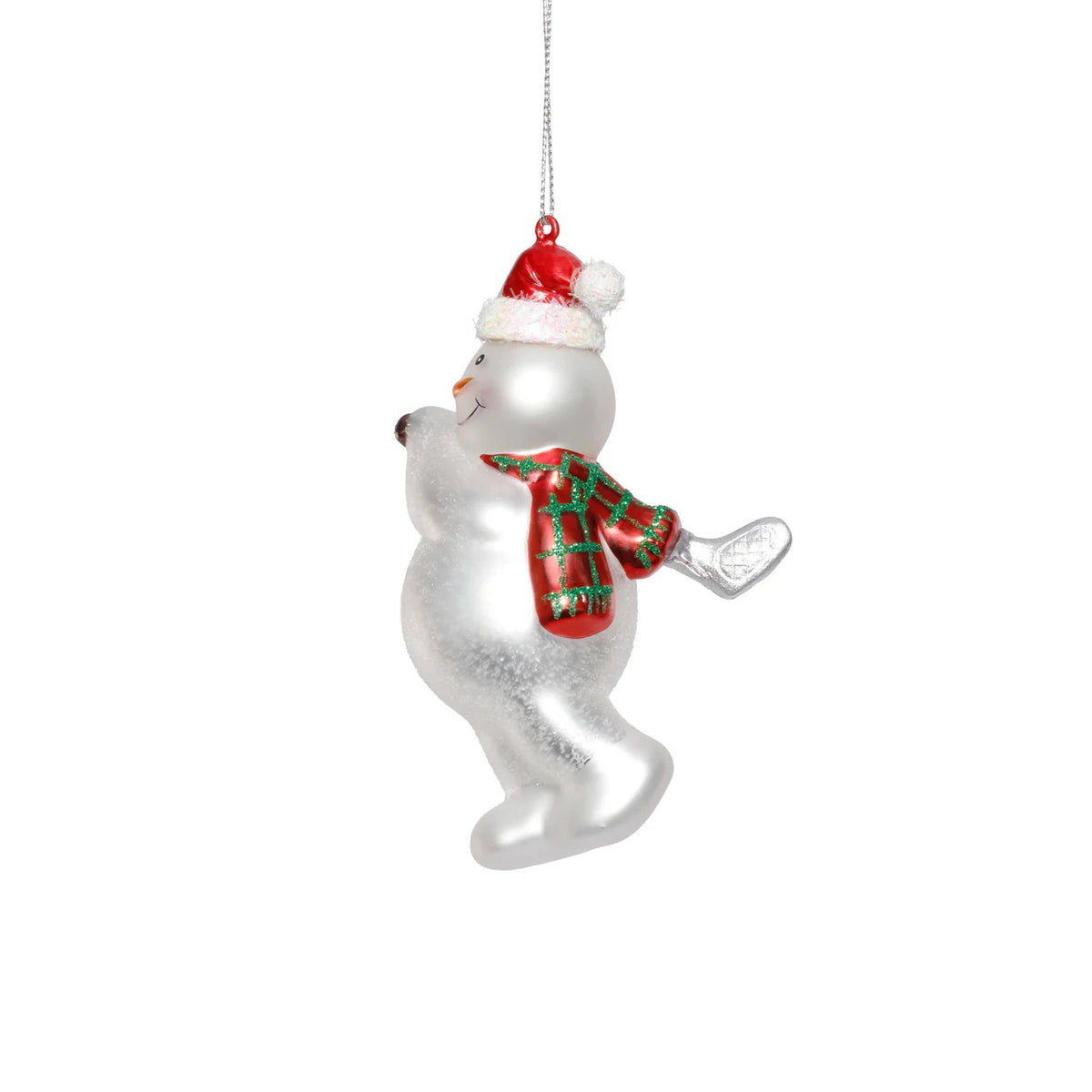 The ZODAX GLASS SNOWMAN PLAYING GOLF ornament, 3.5&quot;x5.25&quot;, hangs by a silver string and features a smiling snowman in a red Santa hat and green scarf, holding one arm up as he plays golf.