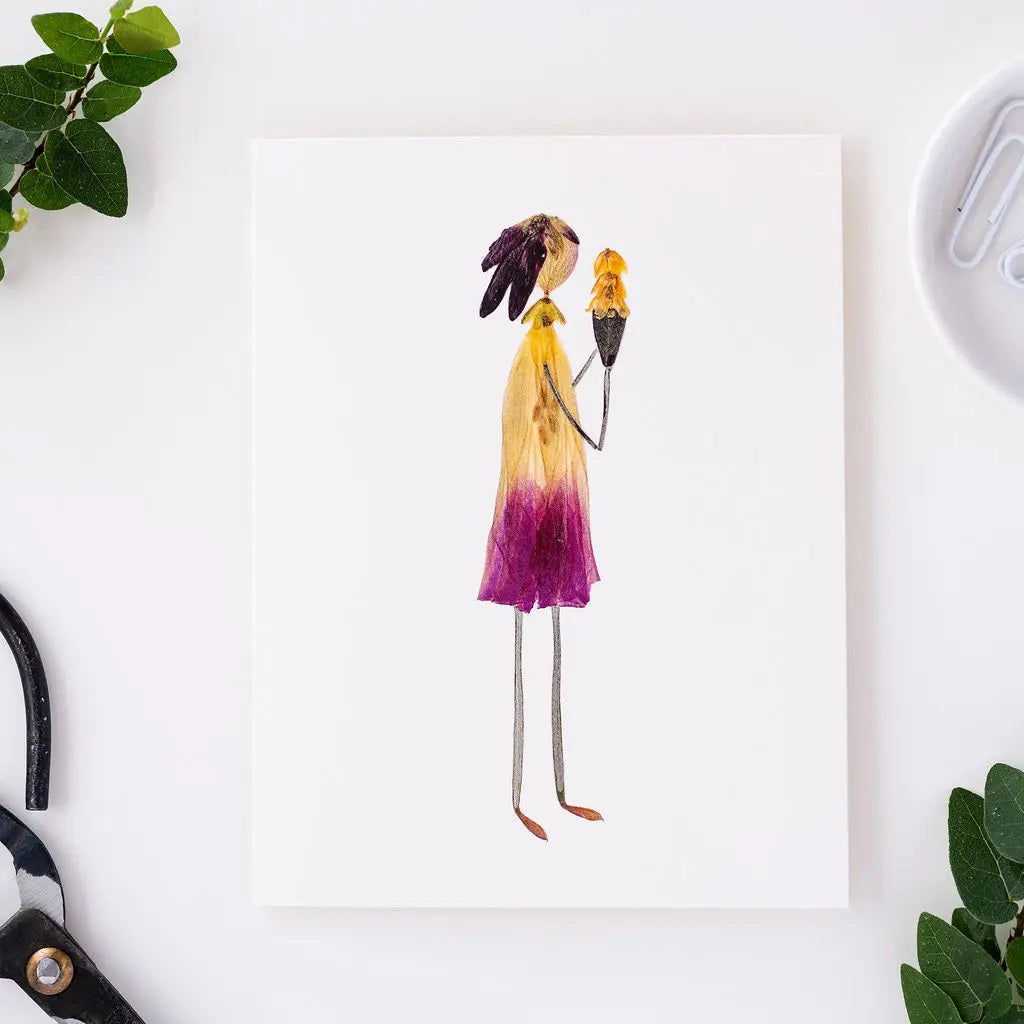 The PETAL PEOPLE PRESS - THREE SCOOPS greeting card by PETAL PEOPLE PRESS features a simple botanical illustration of a person made from pressed flowers and leaves, holding a smaller flower on a white background with natural colors.