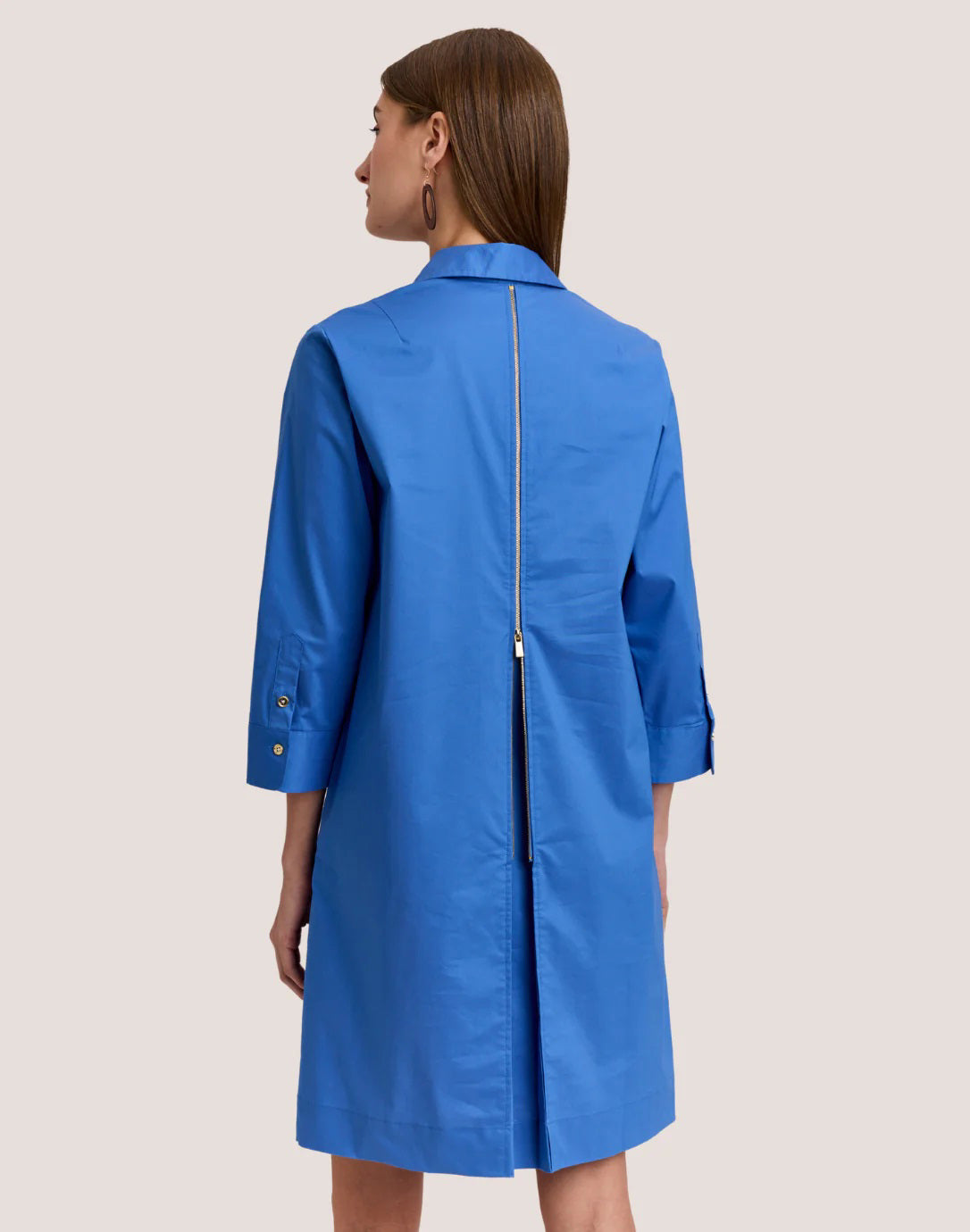 A solid, uniform pink background spotlights the vibrant Guava hue of the HINSON WU - ALESSA 3/4 SLEEVE DRESS—crafted in stylish, machine-washable stretch polished cotton.