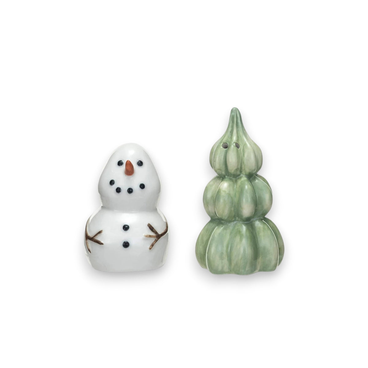 The CREATIVE COOP STONEWARE SNOWMAN AND TREE SALT AND PEPPER SET features a snowman shaker with twig arms and a festive tree-shaped shaker, both displayed on a plain white background.