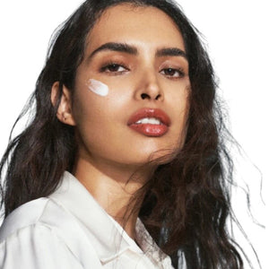 A tall, rectangular white bottle with a square cap labeled "U BEAUTY THE SUPER HYDRATOR 50ML." This moisturizer delivers intense hydration in a 50 ml (1.7 fl oz) size for your skin.