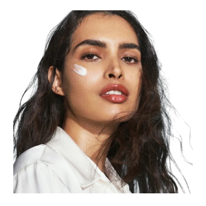 A tall, rectangular white bottle of U Beauty THE SUPER HYDRATOR 15ML, a hyaluronic acid moisturizer with minimalist black text and white cap, delivers intense hydration for up to 48 hours in every 15ml (0.5 fl oz) bottle.