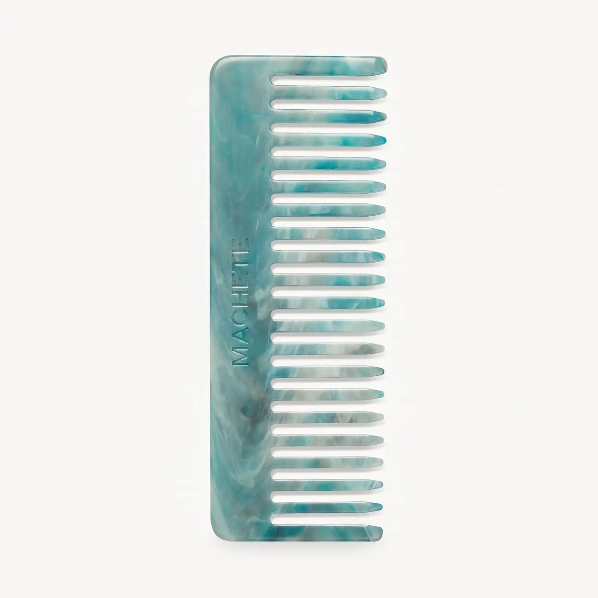 The MACHETE - NO. 2 COMB IN JADEITE is a blue and white marbled Italian acetate wide-tooth comb with "MACHETE" embossed on the side, shown against a plain white background.