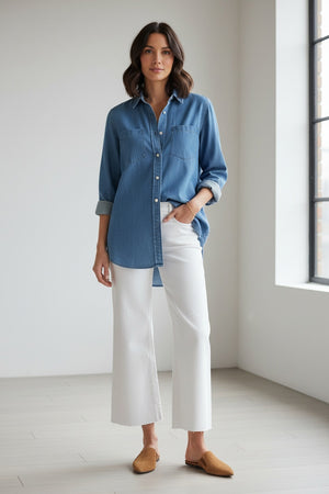 The FRANK & EILEEN GALWAY Gaucho Jean in White features a high-waisted, wide-leg Italian Performance Denim design with front and back pockets, belt loops, and a button-zipper closure, shown flat on a light textured background.