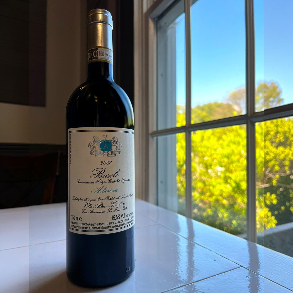 A 750 ml bottle of ELIO ALTARE ‘ARBORINA’ BAROLO 2022 from WINE: HAW RIVER WINE MAN, featuring a cream label with a blue crest, gold foil on the neck, and Italian text highlighting the Arborina vineyard, wine origin, and 15.5% alcohol content.