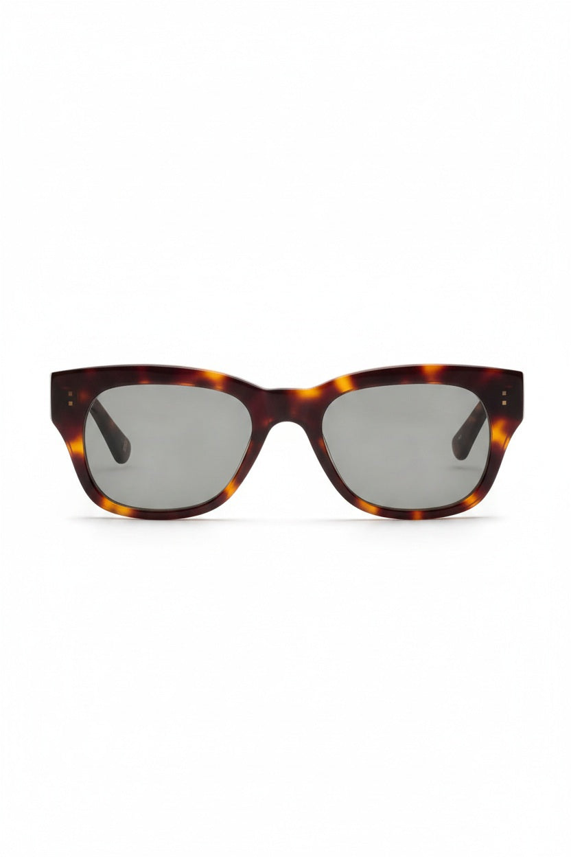 The CADDIS MIKLOS POLARIZED SUNGLASSES feature premium acetate, square dark scratch-resistant lenses, and a thick tortoiseshell frame, shown against a white background.