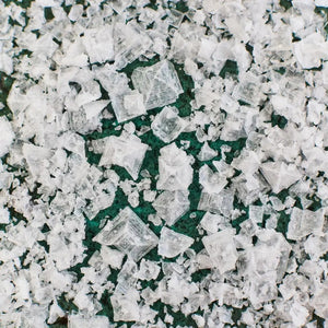 A box of MALDON - SEA SALT FLAKES by GOURMET FOOD SOLUTIONS, featuring a green geometric pattern and the text “Maldon Sea Salt Flakes” on the front.