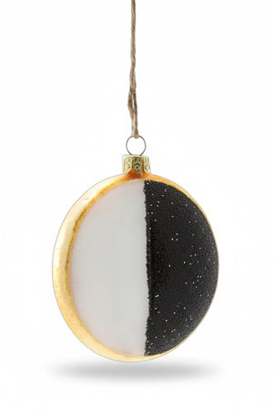 The CODY FOSTER BLACK AND WHITE COOKIE ORNAMENT is a 3.5-inch glass ornament with white and black halves, gold edging, a gold cap, and hangs by a string.