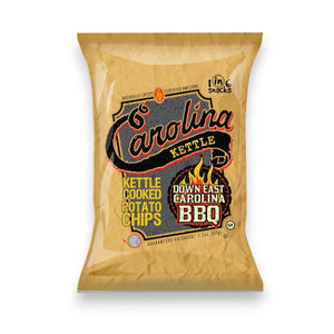 A bag of CAROLINA KETTLE - DOWN EAST BBQ CHIPS from 1 IN 6 SNACKS, featuring a brown and orange design with BBQ flames and bold text, delivers the authentic taste of Eastern North Carolina BBQ sauce accented by a hint of smoky charcoal flavor—making it a true standout among snack foods.