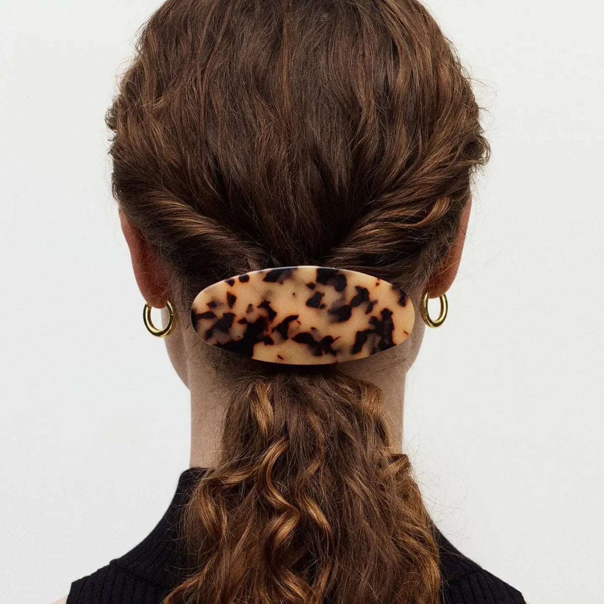 The MACHETE Jumbo Oval Barrette in Alabaster features a smooth, cream-colored, oversized oval design with subtle marbled patterns, shown on a plain white background.