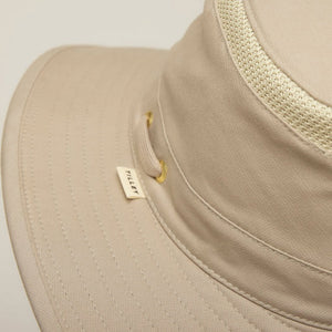 A man with a gray beard wears the TILLEY - AIRFLO HIKERS HAT T4MO-1 IN KHAKI OLIVE, featuring UPF 50+ sun protection, and a matching collared shirt, shown in profile against a plain light background.