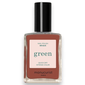 A chart displaying twelve lipstick shades—each swatched alongside its name and color description—features a range of reds and oranges, from coral and cherry to terracotta, pomegranate, and deep berry tones. These hues are designed to perfectly complement your favorite vegan nail polish or pair flawlessly with MANUCURIST - GREEN™ NAIL POLISH IN BRICK by MANUCURIST INC for a coordinated, striking look.