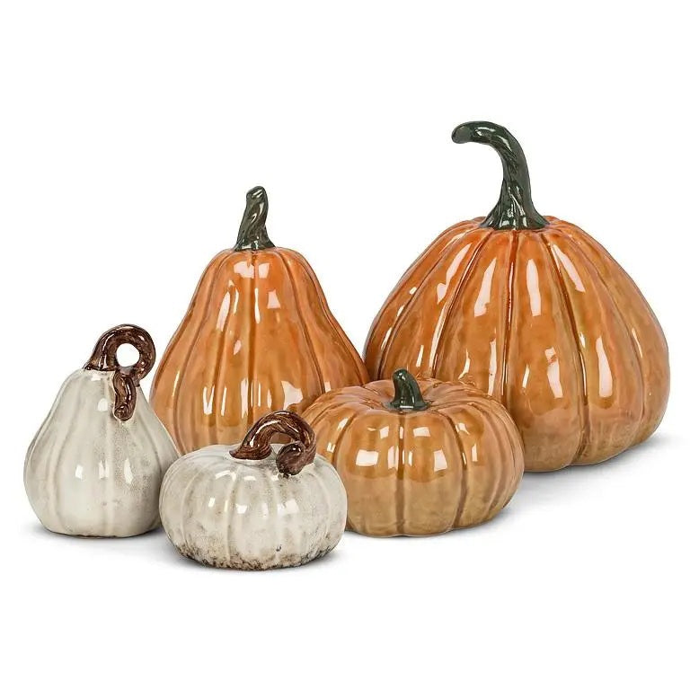 Four glazed ceramic decorative pumpkins and gourds in varying shapes and sizes, including a LARGE CERAMIC PUMPKIN, ranging from small white varieties to a large, ribbed orange pumpkin.