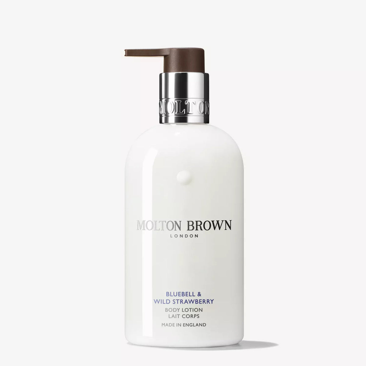 A white pump bottle of MOLTON BROWN Bluebell &amp; Wild Strawberry Body Lotion with silver details, displayed on a plain white background—ideal for fans of floral and fruity scents.