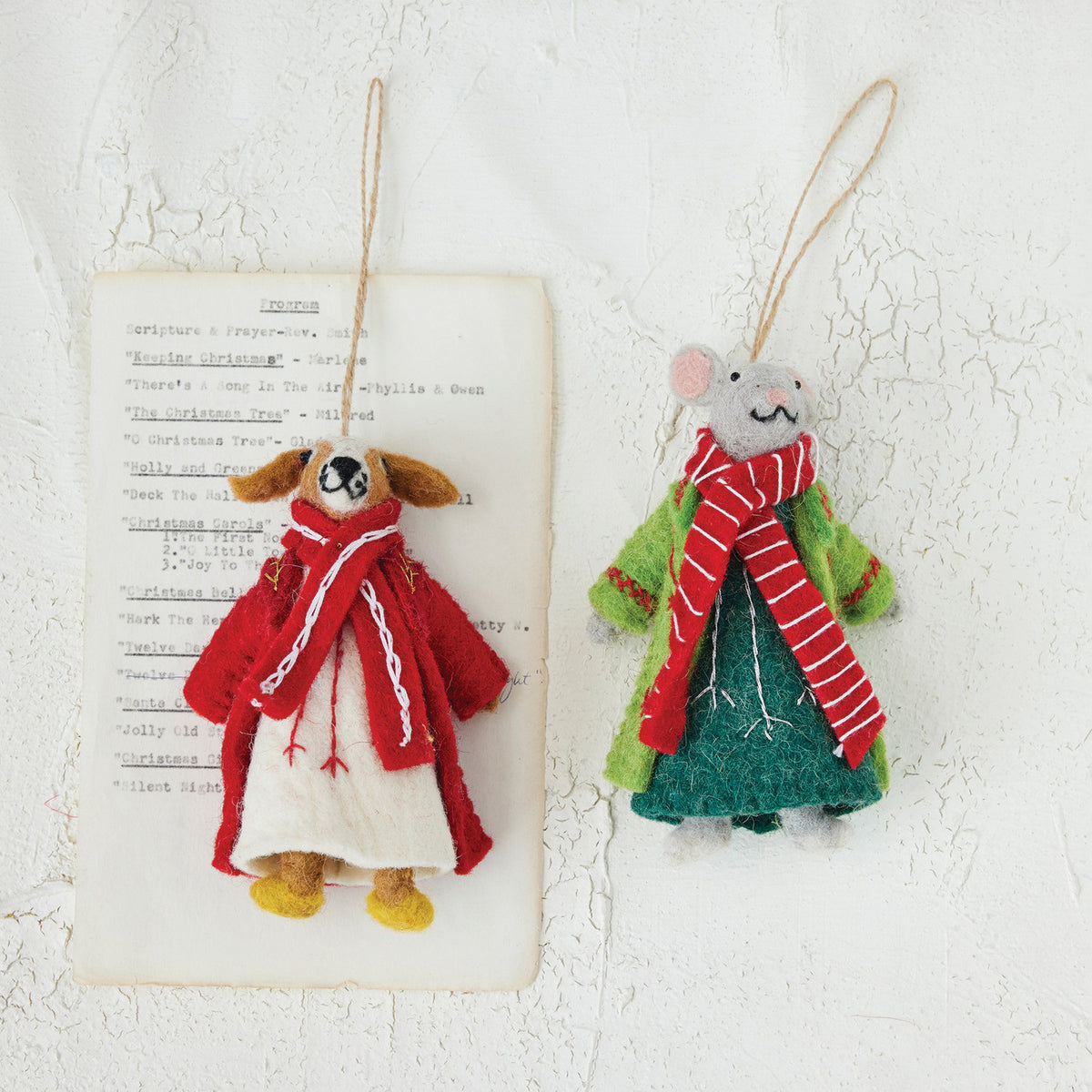 Add festive cheer with the CREATIVE COOP FELT MOUSE AND DOG ORNAMENTS—adorable felt mouse in a green coat and red scarf, and dog in a red coat and scarf, both hanging from strings.