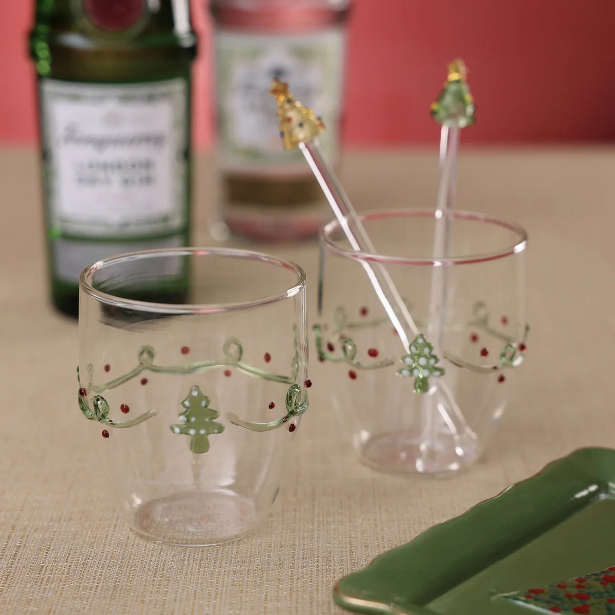 ZODAX HOLIDAY SPRUCE ALL PURPOSE GLASS TUMBLER, a 380 ml soda lime glass decorated with a green garland, red dots, and a small green Christmas tree.