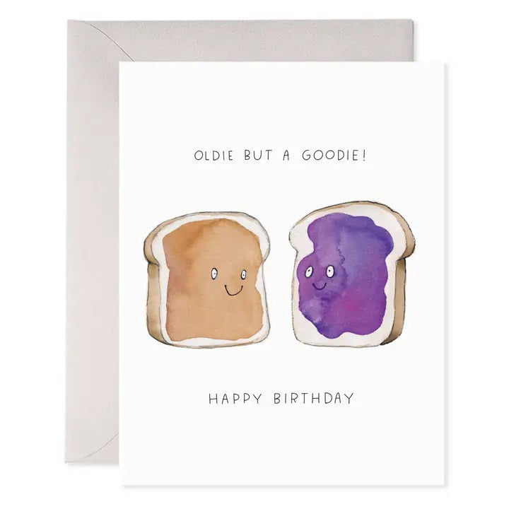 The E. FRANCES - PB&amp;J BIRTHDAY card by E. FRANCES PAPER features smiling peanut butter and jelly toasts on luxe heavyweight paper with the text &quot;Oldie but a Goodie!&quot; above and &quot;Happy Birthday.&quot; Comes with an envelope.
