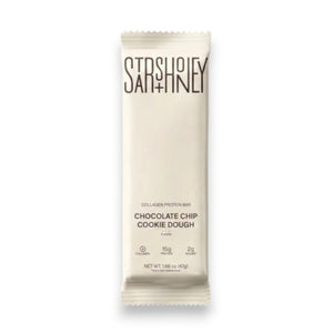 A STARS+HONEY - CHOCOLATE CHIP COOKIE DOUGH protein bar is displayed in white packaging against a neutral background, with the label emphasizing its unique protein blend featuring 15g of protein, only 2g of sugar, and added collagen for a delicious and nourishing snack.