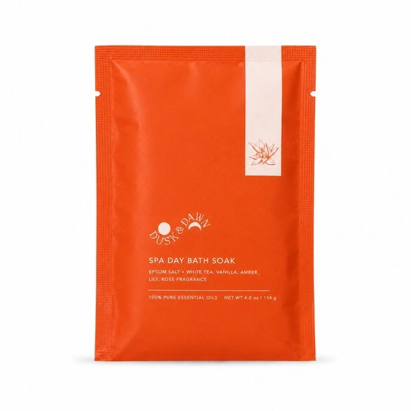 A round metal container filled with coarse white crystals—GIFTEN MARKET’s SPA DAY BATH SOAK in White Tea and Vanilla—viewed from above against a white background, perfect for elevating your self-care or luxury spa experience.