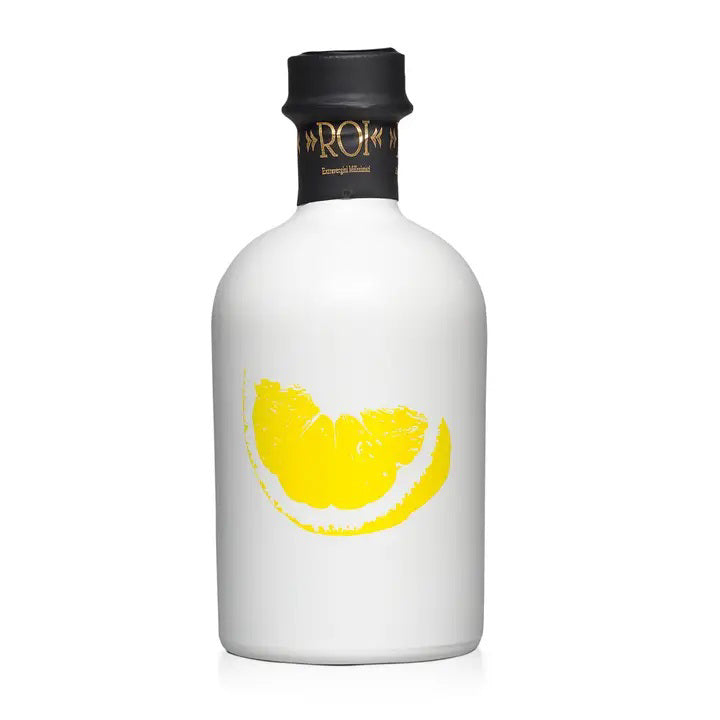 The MERCATO DI BELLINA Italian Lemon Infused Olive Oil comes in a white bottle with a black cap, gold lettering, and a yellow lemon wedge graphic—perfect for adding vibrant flavor to any dish.