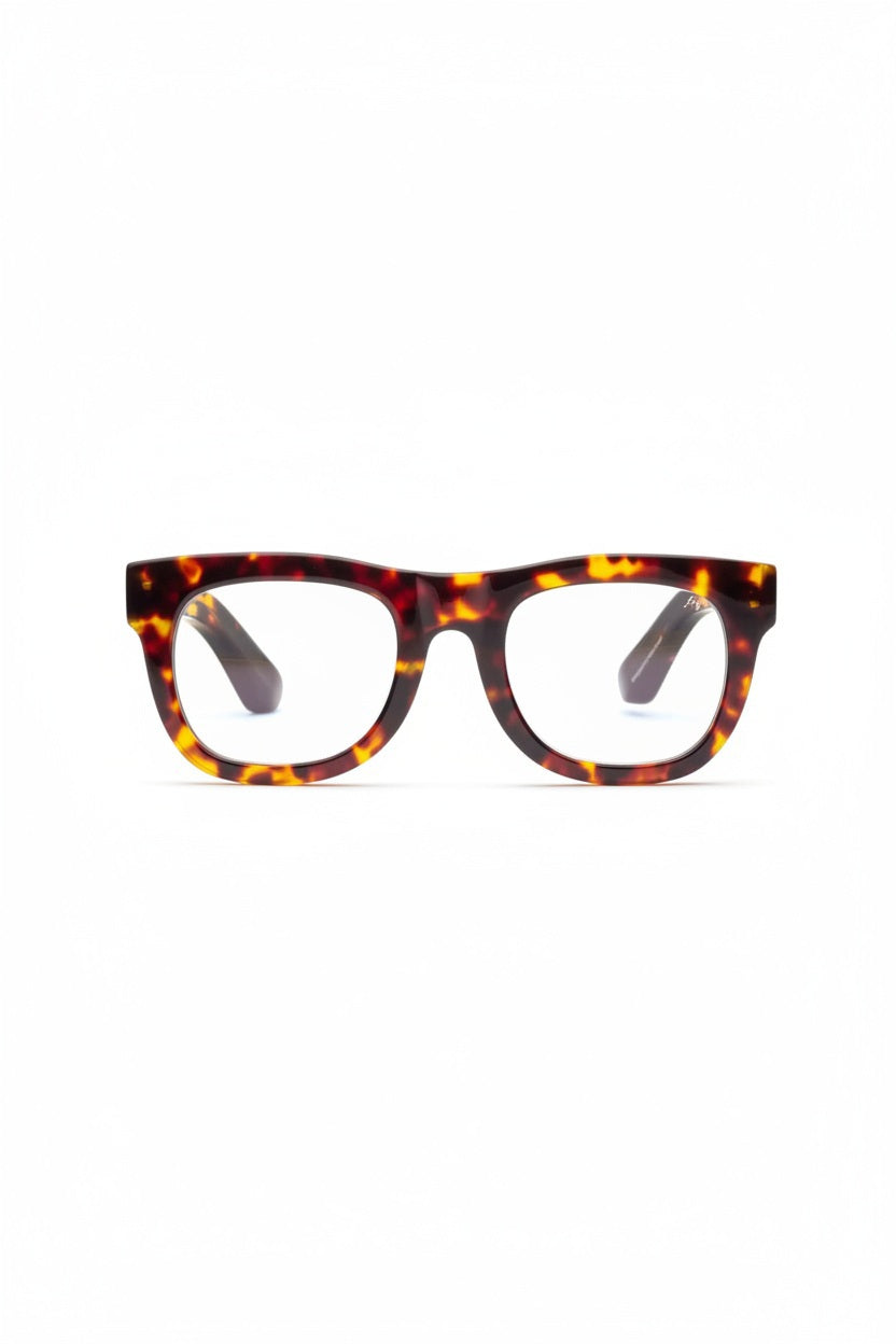 CADDIS D28 Progressive Readers in Turtle feature thick, rectangular acetate frames with a tortoiseshell pattern, shown on a white background and angled slightly to the left—ideal for those seeking premium eyewear.