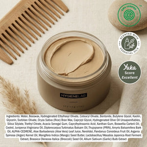 An open, round container of HYGIENELAB - STYLING CLAY displays the smooth, light gray clay inside with a swirled surface. This styling clay from HYGIENELAB provides a medium-strong hold and a natural matte finish.
