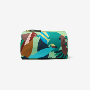 The INOUI EDITIONS VOYAGE NYLON CASE, SMALL features a vibrant tropical print with abstract birds in green, brown, blue, and orange on a light background. This artistic INOUI pouch is perfect as a travel organizer for your essentials.