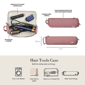 The KUSSHI - HAIR TOOLS TRAVEL CASE IN BLACK is a black cylindrical case by KUSSHI, featuring a handle, black zipper pulls, a white "KUSSHI" label on the front, pink lining accents, and is machine washable for convenience.