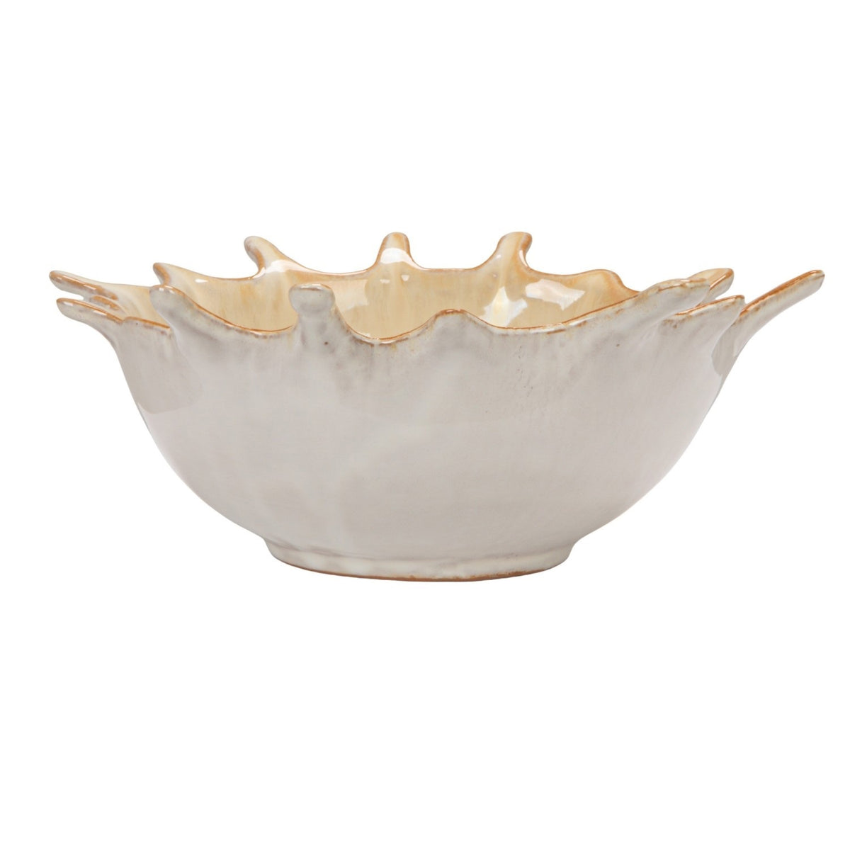 A close-up of the CREATIVE COOP STONEWARE SUNBURST BOWL, a beige ceramic piece with a glossy finish and brown-tinted edges, featuring handcrafted textured details and pointed tips inspired by a leaf’s natural form.