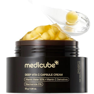 Open jar of MEDICUBE - DEEP VITA C CAPSULE CREAM, 55G by KOSMIC KBEAUTY SKINCARE on right, showing its yellow capsule cream. On the left, ingredient list highlights: Sea Buckthorn Extract, Niacinamide to help brighten skin and address uneven tone, Ascorbic Acid, Vitamins E, Q & P, and Ferulic Acid—all with skin benefits. Set against a warm yellow background.
