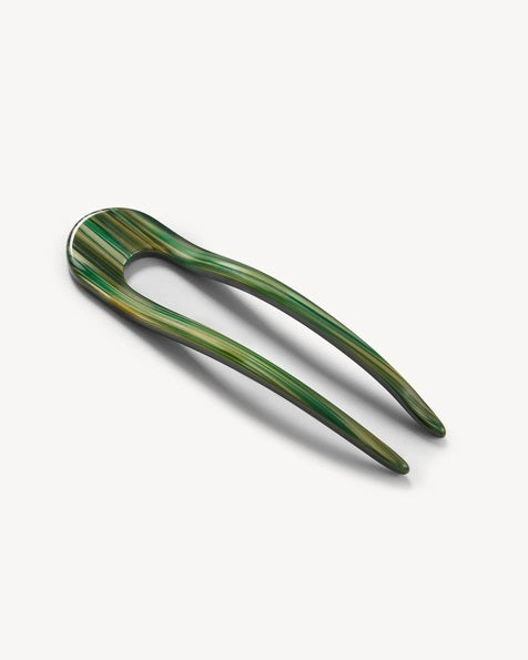 A smooth, black MACHETE - FRENCH HAIR PIN with two prongs, crafted from Italian acetate by MACHETE, rests on a plain white surface.