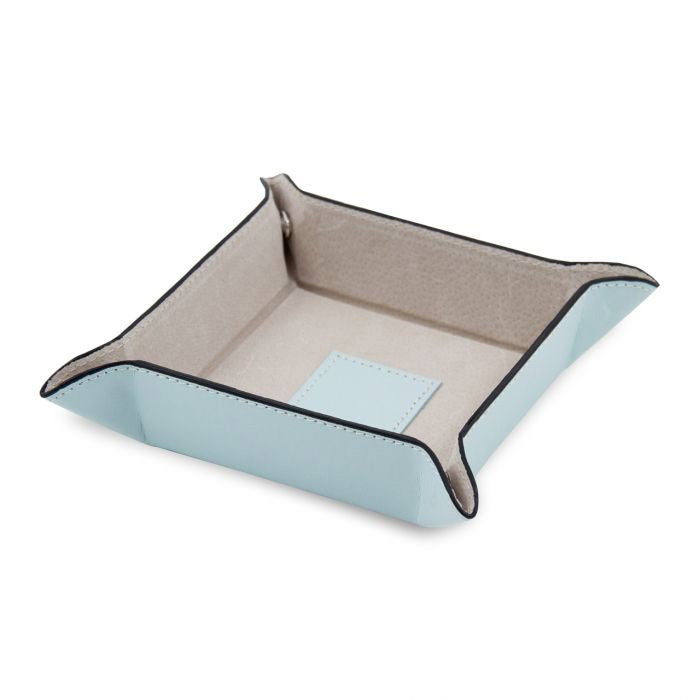 The BEYBERK INTERNATIONAL LEATHER VALET IN LIGHT BLUE is a snap tray with raised edges, beige pigskin leather lining, and a stitched center patch. Shown empty against a white background.