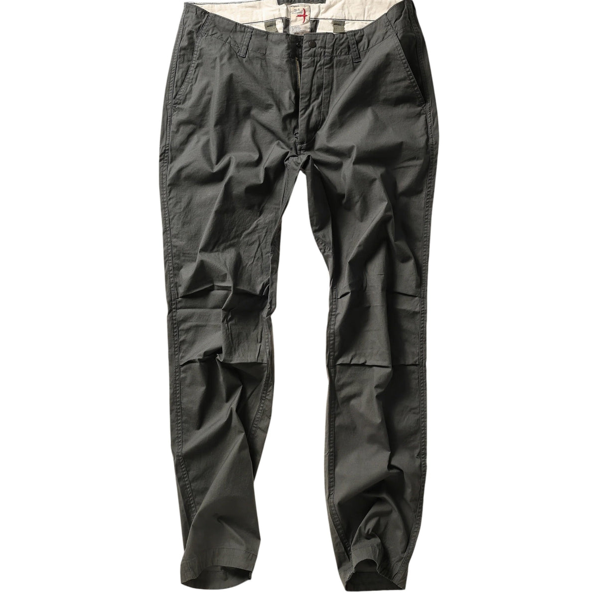 The RELWEN Flyweight Flex Chino in Charcoal, shown from the back with two buttoned pockets and subtle wrinkling, features a slim, straight-leg fit and lightweight stretch fabric for comfort. Pants are displayed flat on a white background.