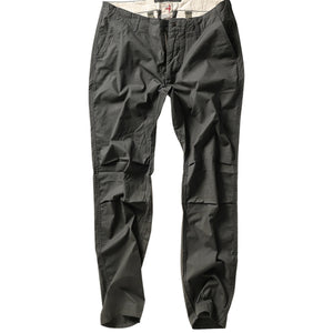 The RELWEN Flyweight Flex Chino in Charcoal, shown from the back with two buttoned pockets and subtle wrinkling, features a slim, straight-leg fit and lightweight stretch fabric for comfort. Pants are displayed flat on a white background.