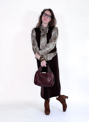 The SEVENTY VENEZIA Leopard Print Tie Neck Blouse by SEVENTY is a long-sleeve Italian viscose top with a bold leopard print and large bow tie collar, shown on a plain white background.