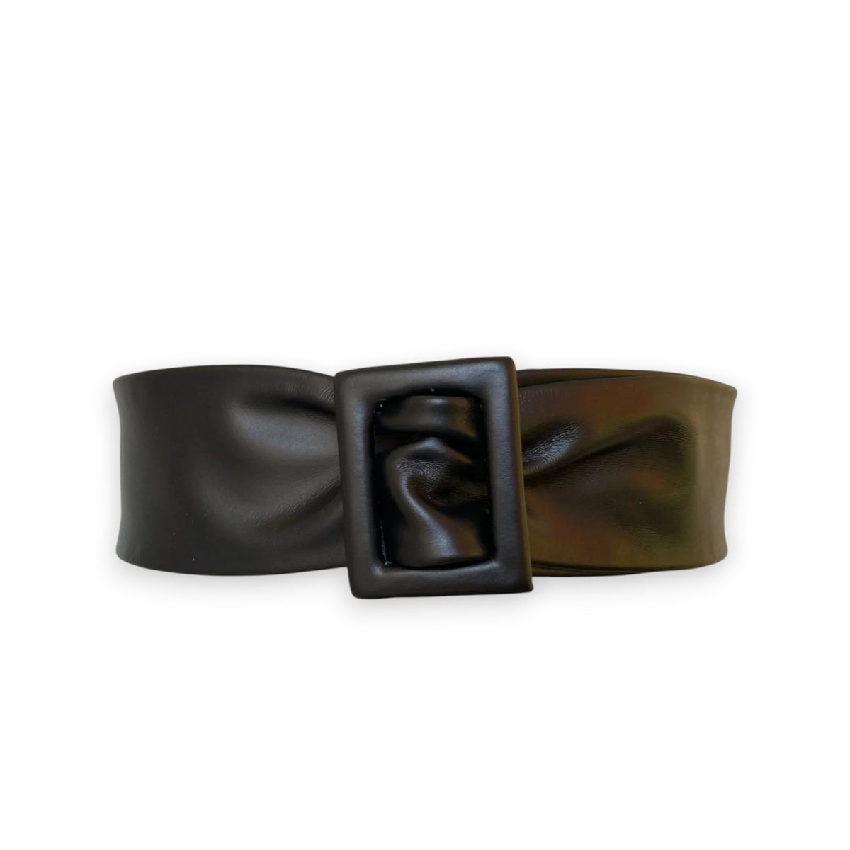 The APROPOS BELT by ADA is a handcrafted brown leather belt with a wide band and smooth texture. Made from genuine Argentinian leather, it features a rectangular buckle, showcased on a plain white background.