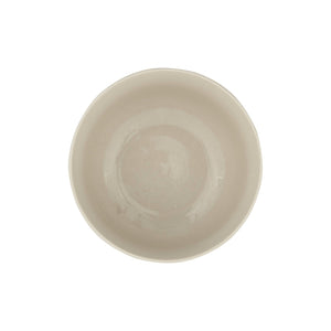 The HAND-STAMPED STONEWARE BOWL WITH BOTANICAL PATTERN by CREATIVE COOP features green leaf and fern illustrations encircling its white ceramic exterior, offering an artisan-inspired look.