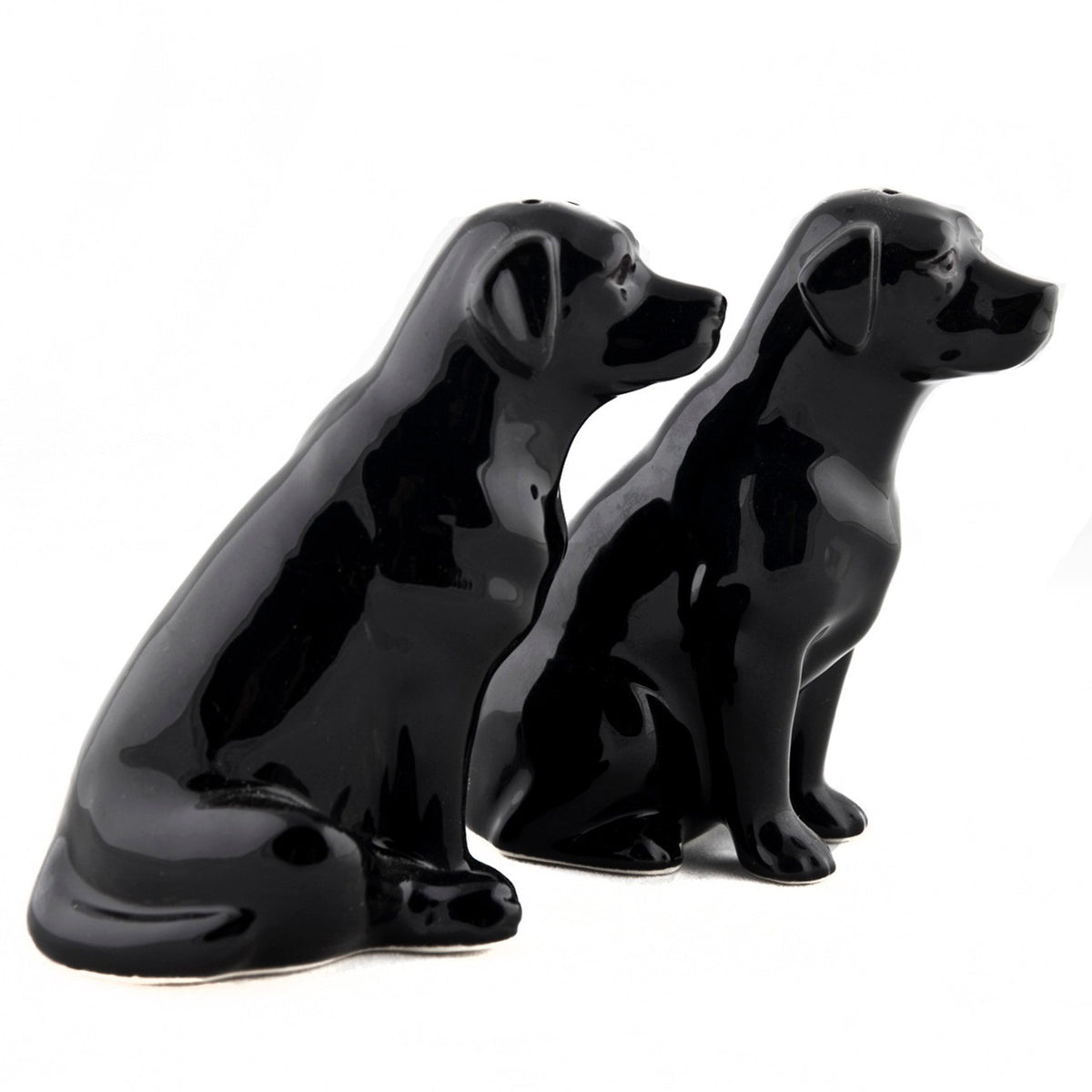 The QUAIL CERAMICS - BLACK LABRADOR SALT AND PEPPER SET from QUAIL DESIGNS features two glossy black handpainted labrador stoneware figurines. Charming and dishwasher proof, they make a delightful addition to any table.