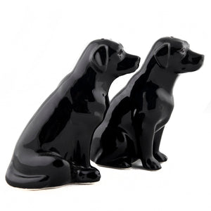 The QUAIL CERAMICS - BLACK LABRADOR SALT AND PEPPER SET from QUAIL DESIGNS features two glossy black handpainted labrador stoneware figurines. Charming and dishwasher proof, they make a delightful addition to any table.