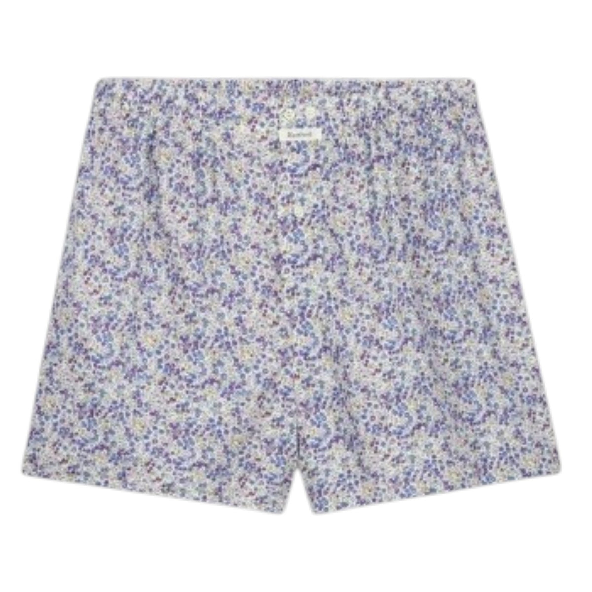 A person stands against a plain background, wearing HARTFORD – COTTON BOXER SHORTS, PATTERN by HARTFORD, featuring a light-colored animal print and crafted from upcycled cotton boxer briefs. Only the lower torso and upper legs are visible.