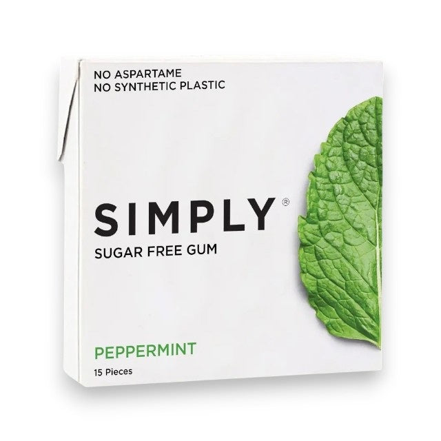 A box of SIMPLY GUM- PEPPERMINT GUM by SIMPLY GUM rests on a green leaf background, highlighting its bold peppermint flavor for irresistibly fresh breath. Overlay text showcases key features: Kosher, Vegan, Aspartame Free, and Non-GMO. The 15-piece box features a mint leaf design and delivers the perfect flavor-packed snack.