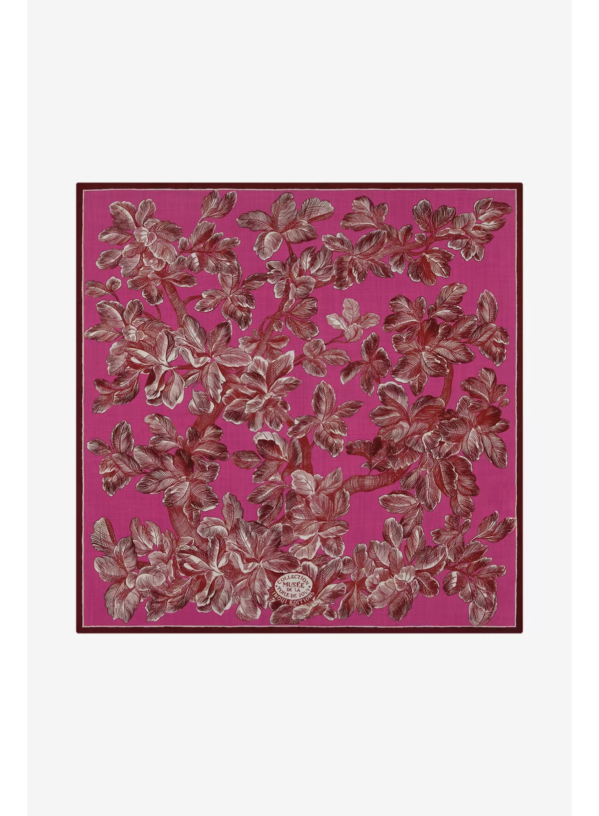 A woman with straight black hair wears a cream sweater and the INOUI EDITIONS - ARBORI Square Wool Scarf in Fuschia by INOUI, crafted from 100% wool and featuring a leaf pattern, draped around her neck against a plain light background.
