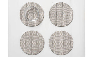 The CHILEWICH Boxwood Round Coasters Set of 4 features woven beige and white coasters with a subtle geometric pattern, combining style and function to protect your table. One holds a clear glass tumbler, all arranged on a white surface.
