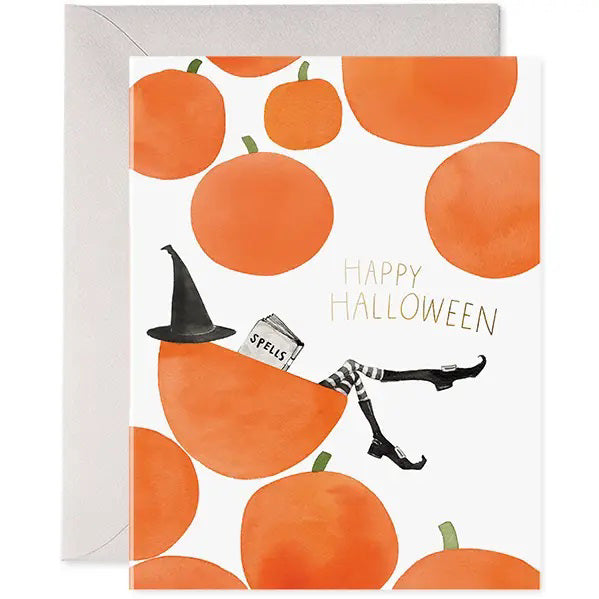 E. FRANCES PAPER - PUMPKIN WITCH CARD: Watercolor card with orange pumpkins and a witch reading "Spells," plus gold foil "Happy Halloween." Includes white envelope. Made in the USA by E. FRANCES PAPER.