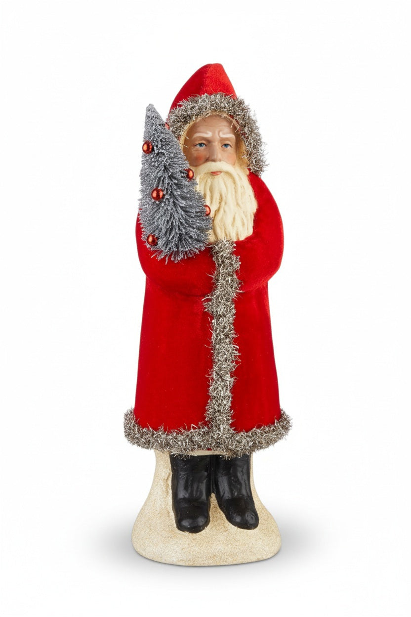 RED VELVET SANTA 12″ figurine in a red coat with silver tinsel trim, holding a small silver bottle-brush Christmas tree, displayed in a 4.25 x 12 decorative vase.